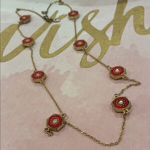 Elegant Gold Tone and Red Charm Necklace